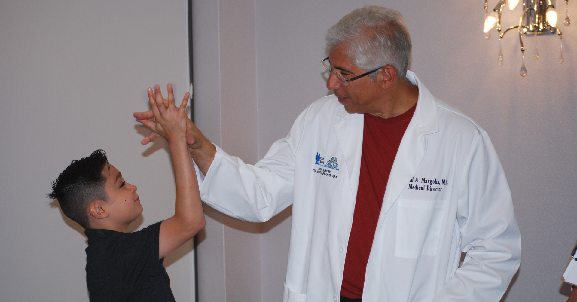 Introductory image: Dr. Margolis with Young Patient - High Five