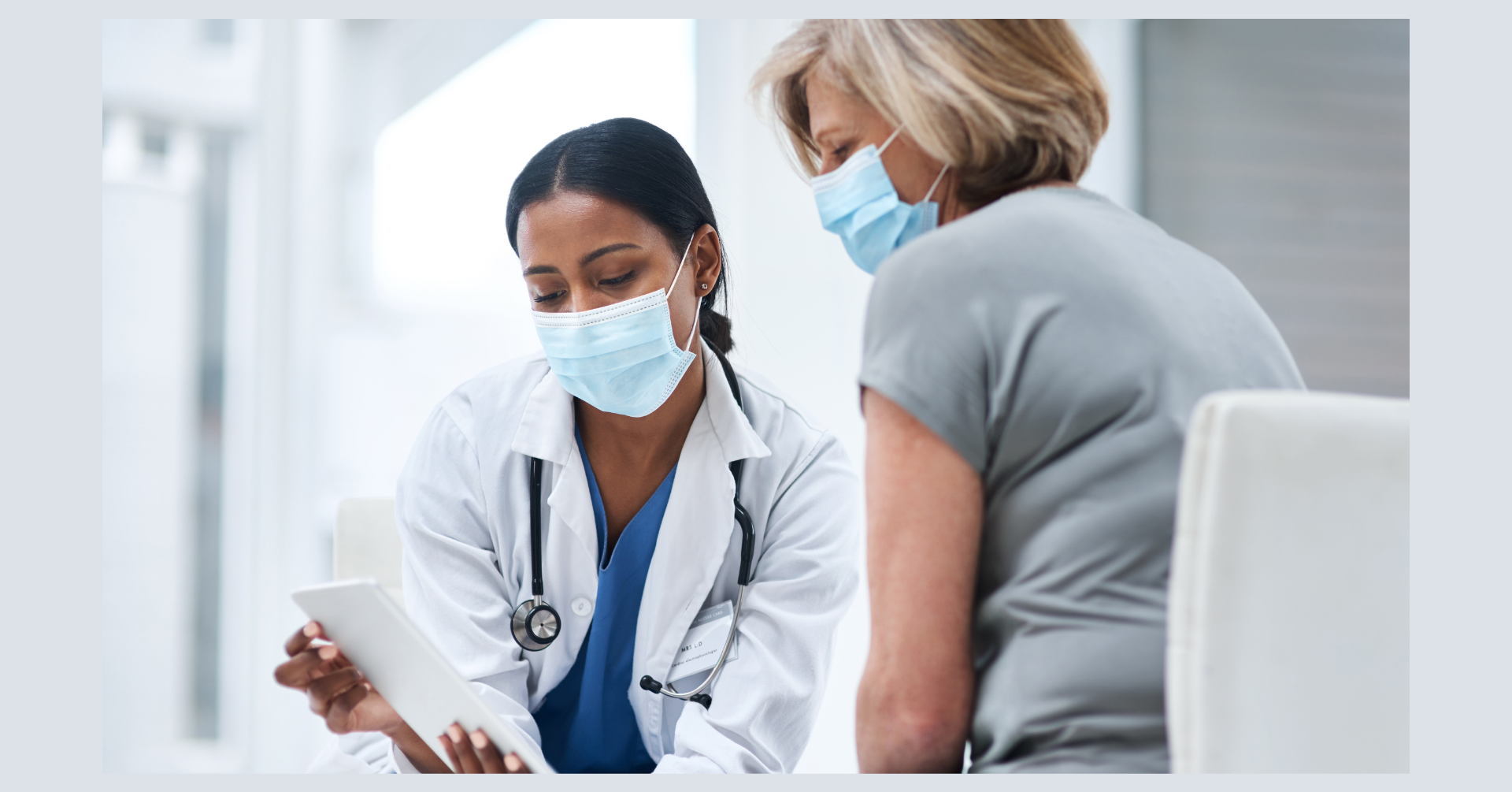 Introductory image: Health Professional and Patient Looking at a Tablet in a Hospital Setting