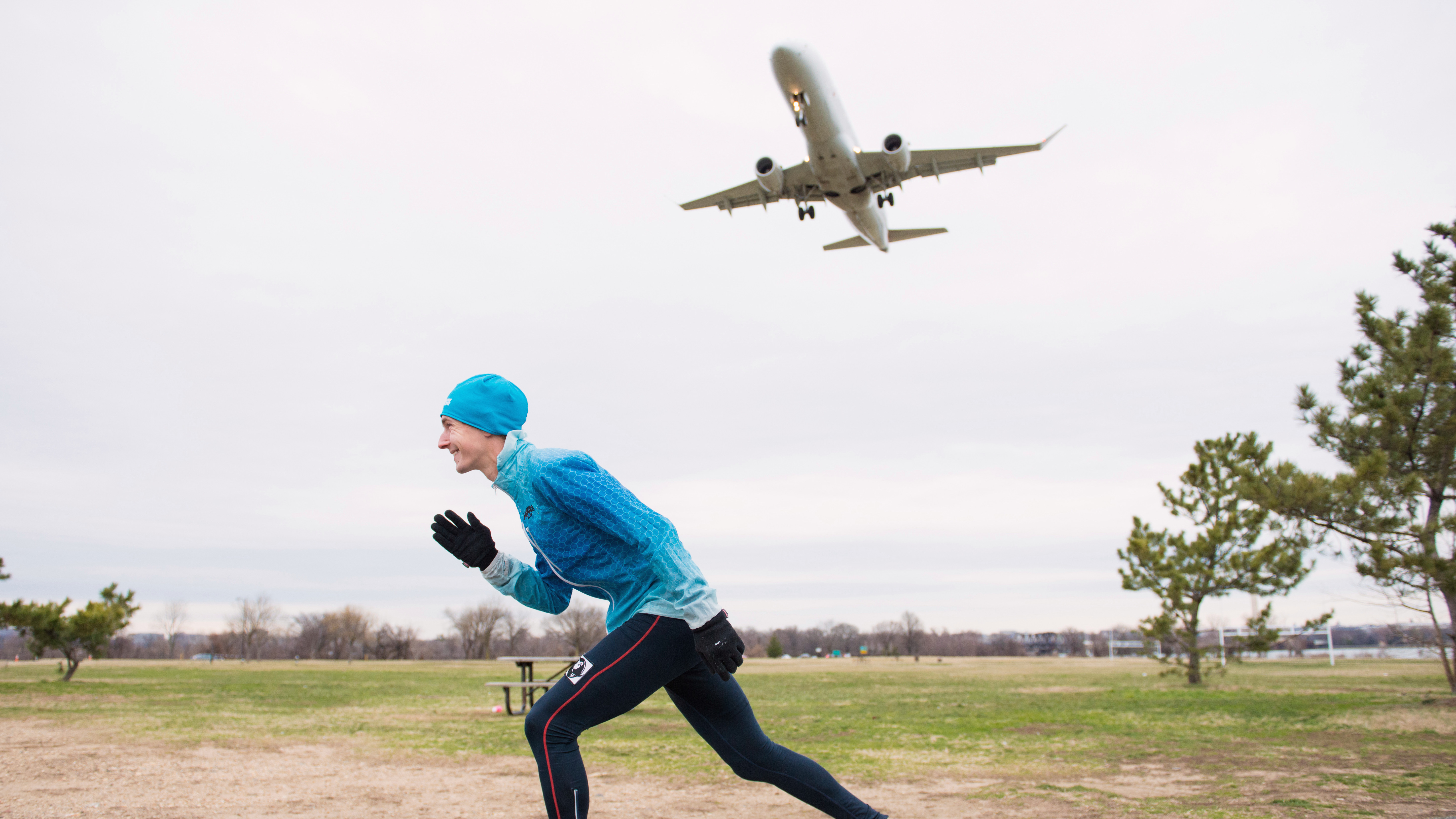 Introductory image: Tyler runs as an airplane takes off